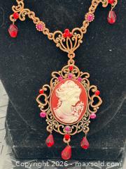 MaxSold Auction: Victorian-style necklace featuring a cameo pendant with red and white accents - Menlo Park (California, USA) SELLER MANAGED Downsizing Online Auction - Henderson Place