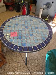MaxSold Auction: Round outdoor dining table with mosaic tile top and steel frame and cover - Longmont (Colorado, USA) PARTNER MANAGED Estate Sale Online Auction -  Twilight Court