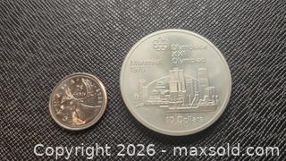 MaxSold Auction: 1976 Summer Olympics in Montreal, sterling silver coin grams 48 ,  - Mississauga (Ontario, Canada) SELLER MANAGED Downsizing Online Auction - Golden Orchard Drive (CONDO)