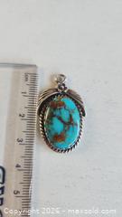 MaxSold Auction: Indigenous American handcrafted turquoise and sterling silver pendant - Mississauga (Ontario, Canada) SELLER MANAGED Downsizing Online Auction - Golden Orchard Drive (CONDO)