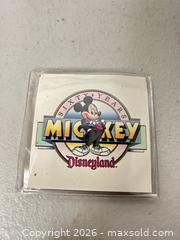 MaxSold Auction: Disneyland / Walt Disney Company 60th Anniversary Brass Commemorative Coin - San Jose (California, USA) SELLER MANAGED Downsizing Online Auction - East Humboldt Street