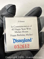 MaxSold Auction: Disneyland / Walt Disney Company 60th Anniversary Brass Commemorative Coin - San Jose (California, USA) SELLER MANAGED Downsizing Online Auction - East Humboldt Street