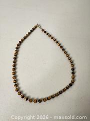 MaxSold Auction: Tiger's Eye Beaded Necklace, 8mm Brown Stones, Gold-Tone Spacers - San Jose (California, USA) SELLER MANAGED Downsizing Online Auction - East Humboldt Street