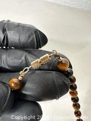 MaxSold Auction: Tiger's Eye Beaded Necklace, 8mm Brown Stones, Gold-Tone Spacers - San Jose (California, USA) SELLER MANAGED Downsizing Online Auction - East Humboldt Street