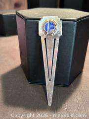MaxSold Auction: VINTAGE 1939 NEW YORK'S WORLD'S FAIR NICKEL PLATED BRASS BOOKMARK EMBOSSED LOGO - Aurora (Ontario, Canada) SELLER MANAGED Estate Sale Online Auction -  Closs Square