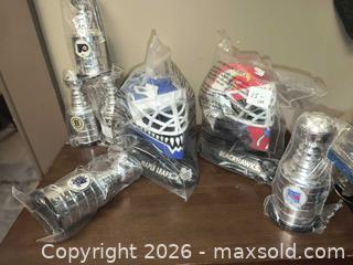 MaxSold Auction: Hockey Collection Mask and Stanley Cups  - Kingston (Ontario, Canada) SELLER MANAGED Downsizing Online Auction - Railway