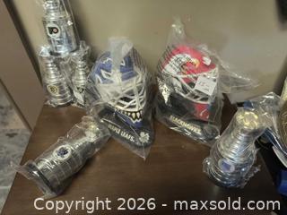 MaxSold Auction: Hockey Collection Mask and Stanley Cups  - Kingston (Ontario, Canada) SELLER MANAGED Downsizing Online Auction - Railway