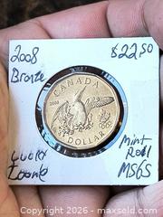 MaxSold Auction: Lucky Loonie Bronze Uncircualted Olympic Coin - Kingston (Ontario, Canada) SELLER MANAGED Downsizing Online Auction - Railway