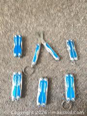 MaxSold Auction: Leatherman SQUIRT 5XP4 1XS4 Blue Keychain Multi-Tool Set of 6 - Hamilton (Ontario, Canada) SELLER MANAGED Estate Sale Online Auction - Concession Street