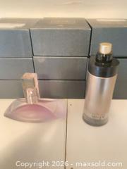 MaxSold Auction: Two women's full-size perfume bottles — Armani code 90percent Klein euphoria 70 percent - Hamilton (Ontario, Canada) SELLER MANAGED Estate Sale Online Auction - Concession Street