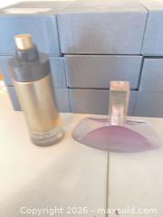 MaxSold Auction: Two women's full-size perfume bottles — Armani code 90percent Klein euphoria 70 percent - Hamilton (Ontario, Canada) SELLER MANAGED Estate Sale Online Auction - Concession Street