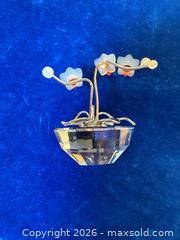 MaxSold Auction: Swarovski Orchid Flowers, Pineapple, Bears. more A - Metro Vancouver A (British Columbia, Canada) SELLER MANAGED Downsizing Online Auction - College Highroad
