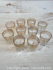 MaxSold Auction: Set of 10 Vintage French Retro Shot Glasses with Gold Trim and Star Burst Bottoms - Kingston (Ontario, Canada) SELLER MANAGED Downsizing Online Auction - Bishop Street