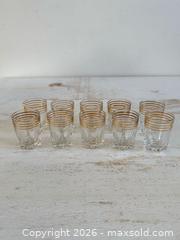 MaxSold Auction: Set of 10 Vintage French Retro Shot Glasses with Gold Trim and Star Burst Bottoms - Kingston (Ontario, Canada) SELLER MANAGED Downsizing Online Auction - Bishop Street