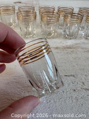 MaxSold Auction: Set of 10 Vintage French Retro Shot Glasses with Gold Trim and Star Burst Bottoms - Kingston (Ontario, Canada) SELLER MANAGED Downsizing Online Auction - Bishop Street