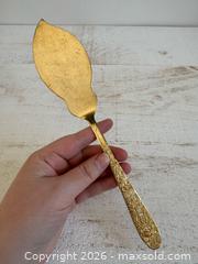 MaxSold Auction: Vintage Golden Lifetime Cutlery Cake Server with Floral Handle  - Kingston (Ontario, Canada) SELLER MANAGED Downsizing Online Auction - Bishop Street