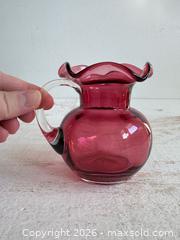 MaxSold Auction: Vintage Small Cranberry Glass Vase with Ruffle Neck and Handle  - Kingston (Ontario, Canada) SELLER MANAGED Downsizing Online Auction - Bishop Street