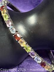 MaxSold Auction: Sterling Silver .925  Bangle Bracelet w/ Multi Colored Semi Precious cut Stones Double safety Clasp  - Idaho Springs (Colorado, USA) PARTNER MANAGED Estate Sale Online Auction - Idaho Street