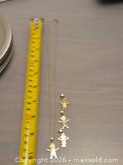 MaxSold Auction: 14K Yellow Gold Necklace + Children's Figure Charms, 6.5 g - Toronto (Ontario, Canada) PARTNER MANAGED Estate Sale Online Auction - Cobden