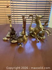 MaxSold Auction: Mixed metal lot: brass & bronze candlesticks, figurines, bell (8 pcs) - Coquitlam (British Columbia, Canada) SELLER MANAGED Reseller Online Auction - Robson Drive