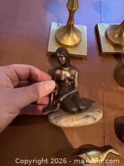 MaxSold Auction: Mixed metal lot: brass & bronze candlesticks, figurines, bell (8 pcs) - Coquitlam (British Columbia, Canada) SELLER MANAGED Reseller Online Auction - Robson Drive