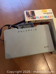 MaxSold Auction: Polaroid Automatic 210 / Land Camera 210 (Instant Pack-Film) - Coquitlam (British Columbia, Canada) SELLER MANAGED Reseller Online Auction - Robson Drive