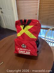 MaxSold Auction: Red Emergency First Aid Backpack with Reflective Strips - Coquitlam (British Columbia, Canada) SELLER MANAGED Reseller Online Auction - Robson Drive