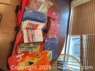 MaxSold Auction: Red Emergency First Aid Backpack with Reflective Strips - Coquitlam (British Columbia, Canada) SELLER MANAGED Reseller Online Auction - Robson Drive