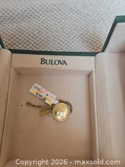 MaxSold Auction: Bulova Two-Tone Gold Tone Quartz Wristwatch 40–44mm - East Bridgewater (Massachusetts, USA) SELLER MANAGED Downsizing Online Auction - Laurel Street