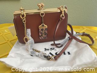 MaxSold Auction: Coach Cognac Leather Crossbody Clutch with Removable Strap - Las Vegas (Nevada, USA) PARTNER MANAGED Estate Sale Online Auction - Argent Star Court
