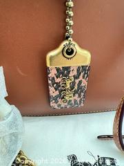 MaxSold Auction: Coach Cognac Leather Crossbody Clutch with Removable Strap - Las Vegas (Nevada, USA) PARTNER MANAGED Estate Sale Online Auction - Argent Star Court