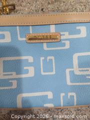 MaxSold Auction: Guess Light Blue Wristlet with Tan Trim & Gold Hardware - Las Vegas (Nevada, USA) PARTNER MANAGED Estate Sale Online Auction - Argent Star Court