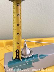 MaxSold Auction: Silver Tone Silver-Plated Candle Snuffer with Ornate Floral Border - Las Vegas (Nevada, USA) PARTNER MANAGED Estate Sale Online Auction - Argent Star Court