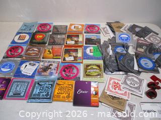 MaxSold Auction: 24 Unopened Sets Of Accoustic And Electric Guitar Strings Various Makers With 65 Unused Single Guitar Strings Various Makers. Tuner & Capo's. - Toronto (Ontario, Canada) SELLER MANAGED Estate Sale Online Auction - Annette Street