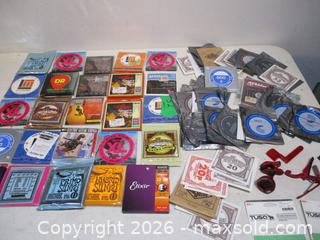 MaxSold Auction: 24 Unopened Sets Of Accoustic And Electric Guitar Strings Various Makers With 65 Unused Single Guitar Strings Various Makers. Tuner & Capo's. - Toronto (Ontario, Canada) SELLER MANAGED Estate Sale Online Auction - Annette Street