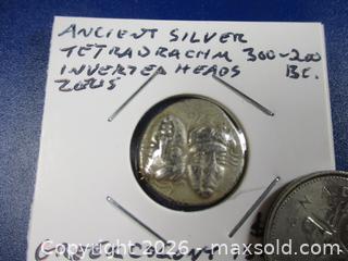 MaxSold Auction: Ancient Greek Silver Drachm Currency Coin. Inverted Heads Of Zeus. 300 BC To 200 BC. - Toronto (Ontario, Canada) SELLER MANAGED Estate Sale Online Auction - Annette Street