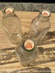 MaxSold Auction: Lot of 5 Vintage Clear Glass Milk Bottles with Palm Paper Seal & Embossing - Saanich (British Columbia, Canada) SELLER MANAGED Downsizing Online Auction - Dunsterville Avenue
