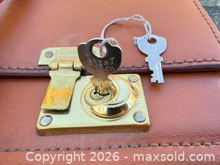 MaxSold Auction: Tan Cognac Leather Briefcase / Attache, Burgundy Lining - Saanich (British Columbia, Canada) SELLER MANAGED Downsizing Online Auction - Dunsterville Avenue