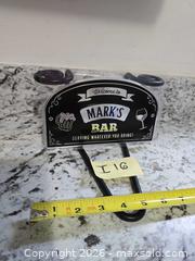 MaxSold Auction: LOT "I 16"- NEW- "Mark's Bar" Sign - Kingston (Ontario, Canada) SELLER MANAGED Downsizing Online Auction - Morenz Crescent