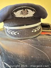 MaxSold Auction: Leather Travel Briefcase with Pilot Cap and Adhered Collectible Stickers  - Delaware City Township (Ohio, USA) PARTNER MANAGED Downsizing Online Auction - Hillside Drive