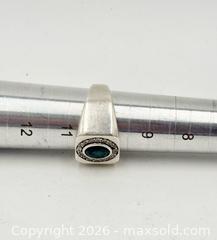 MaxSold Auction: 925 Sterling Silver Men's Signet Ring featuring an oval-cut centre emerald Size 10.5 - Esquimalt (British Columbia, Canada) PARTNER MANAGED Reseller Online Auction -  Lampson Street