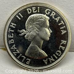 MaxSold Auction: 1964 Canadian Silver Dollar, a commemorative coin issued to mark the 100th anniversary  - Toronto (Ontario, Canada) SELLER MANAGED Reseller Online Auction - Dartmoor Drive