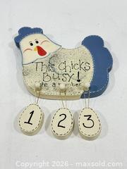 MaxSold Auction: This Chicks Busx ! She has 3 eggs -  Wooden Chicken  surface paint  Wall Decor  - New Westminster (British Columbia, Canada) SELLER MANAGED Reseller Online Auction - Columbia Street
