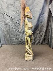 MaxSold Auction: Carved African Tribal Wood Figurine with Natural Fiber Hair, 22 in - Cobourg (Ontario, Canada) SELLER MANAGED Estate Sale Online Auction -  King Street East