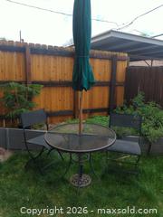 MaxSold Auction: Metal outdoor bistro set with two chairs and umbrella with stand. - Lakewood (Colorado, USA) PARTNER MANAGED Moving Online Auction -  West Virginia Avenue