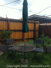 MaxSold Auction: Metal outdoor bistro set with two chairs and umbrella with stand. - Lakewood (Colorado, USA) PARTNER MANAGED Moving Online Auction -  West Virginia Avenue