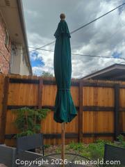 MaxSold Auction: Metal outdoor bistro set with two chairs and umbrella with stand. - Lakewood (Colorado, USA) PARTNER MANAGED Moving Online Auction -  West Virginia Avenue