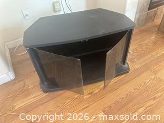 MaxSold Auction: Black TV Stand with Smoked Glass Doors, 32 in W - Las Vegas (Nevada, USA) PARTNER MANAGED Estate Sale Online Auction - Masked Duck Avenue