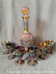 MaxSold Auction: Imperial (IG) Star and File Smoke/Peacock Carnival Glass Decanter and Goblet Set - Bremerton (Washington, USA) SELLER MANAGED Estate Sale Online Auction - Burwell Street
