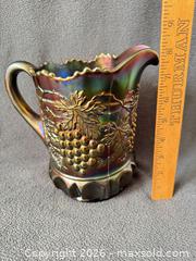 MaxSold Auction: Northwood Amethyst Grape and Cable Carnival Glass Pitcher with Six Tumblers - Bremerton (Washington, USA) SELLER MANAGED Estate Sale Online Auction - Burwell Street
